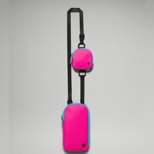 Lululemon neon pink crossbody phone/card holder with headphone pouch